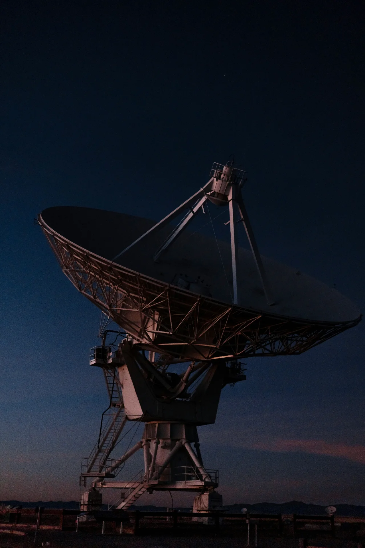 Radio telescope dish at dusk